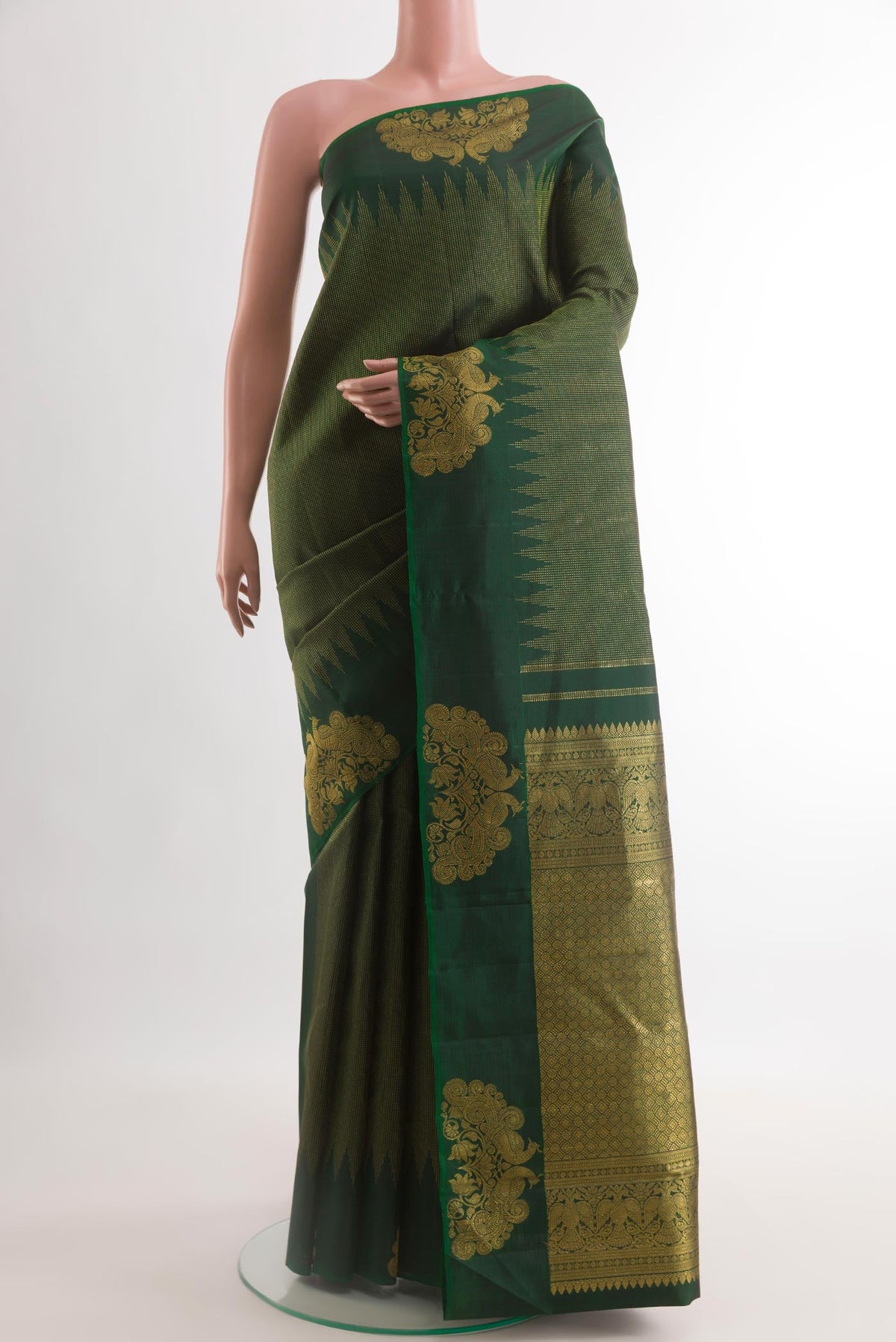 Bottle Green Kanjivaram Silk Saree with Stripes on the body and Fancy Border.  displayed on a mannequin