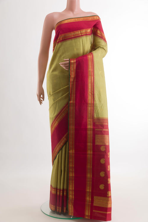 Beige Kanchipuram Silk Saree with Checked design on the body and Zari Border.  displayed on a mannequin