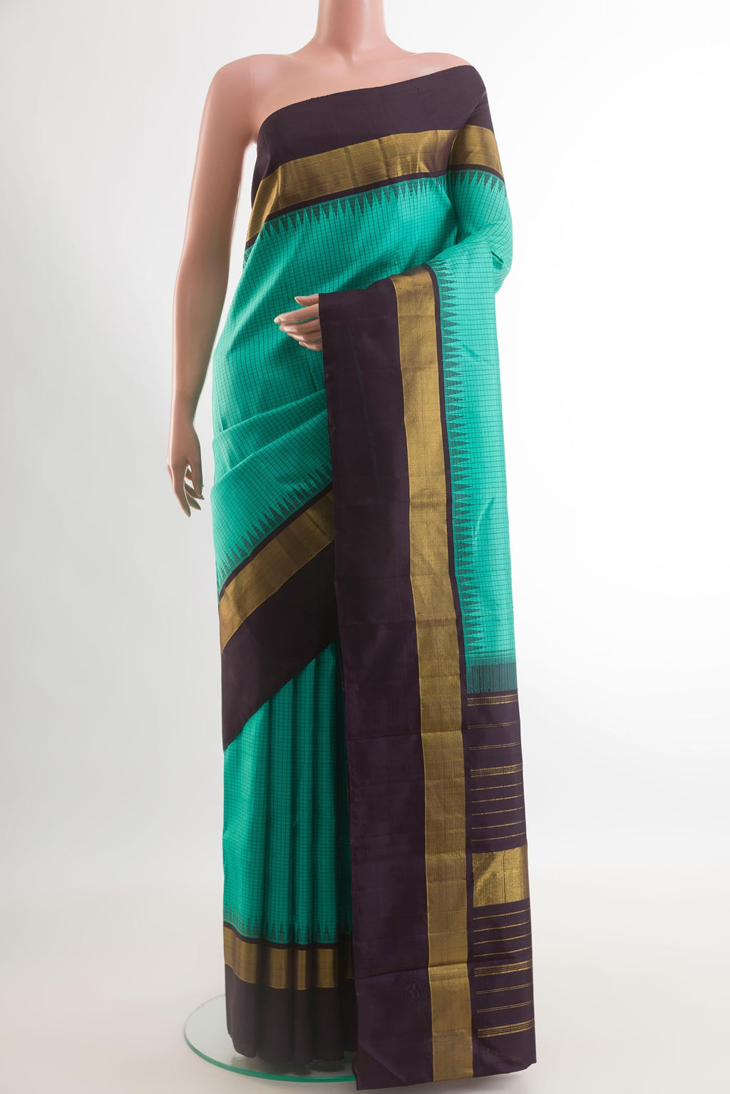Sea Green Kanjivaram Silk Saree with Checked design on the body and Zari Border.  displayed on a mannequin