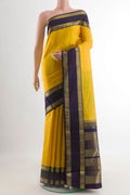 Yellow Kanchipuram Silk Saree with Zari Butta on the body and Zari Border.  displayed on a mannequin