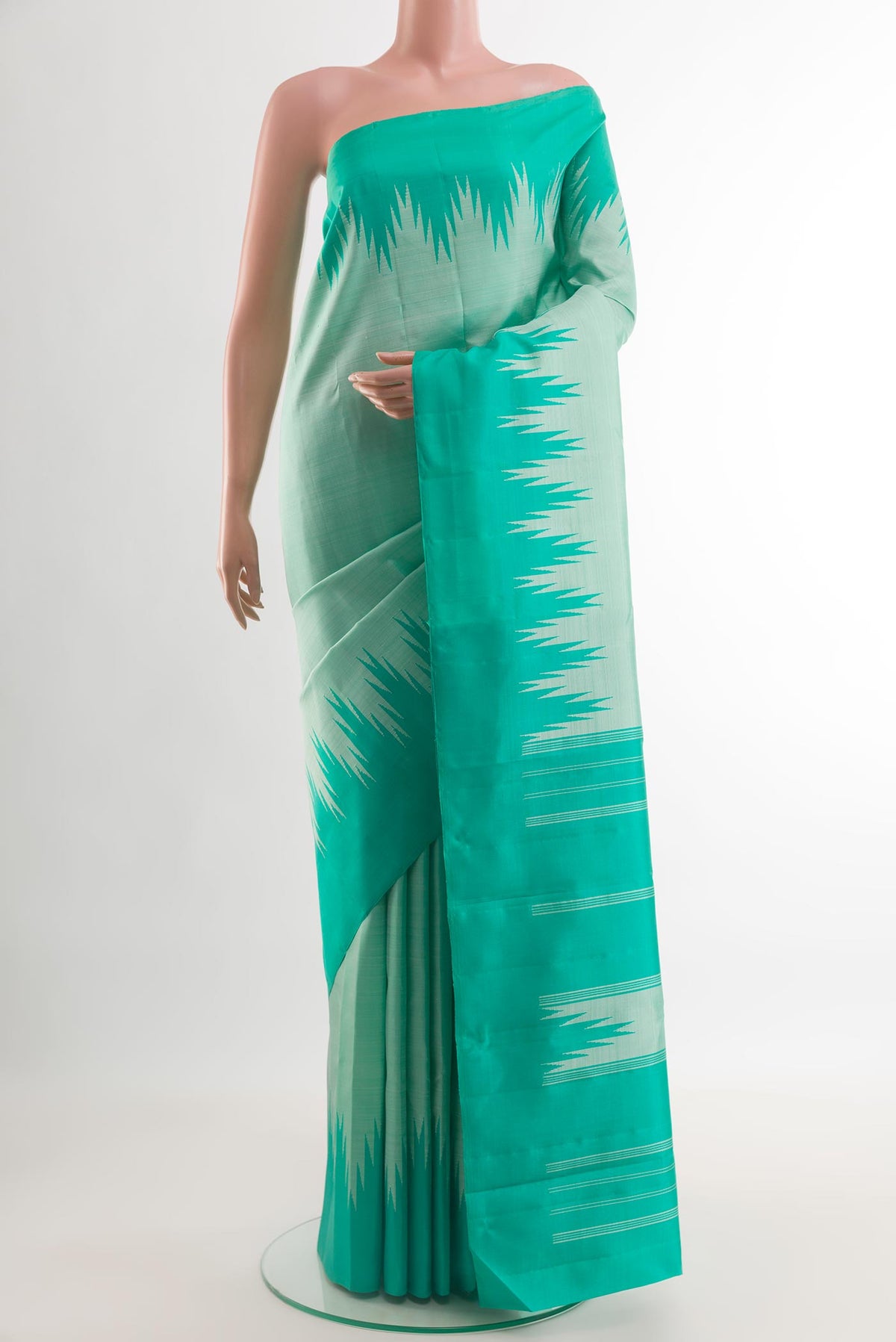 Mint Green Kanjivaram Silk Saree with Plain Body and Temple Border.  displayed on a mannequin