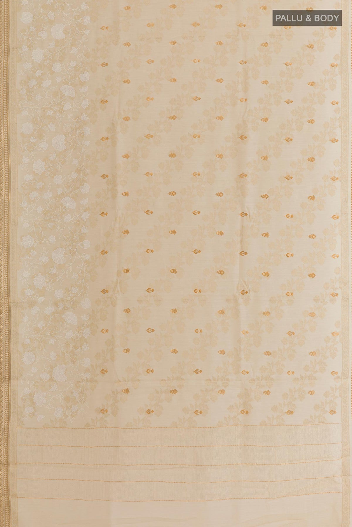 Flat view of Cream Tussar Silk Saree with Embroidery on the body and Zari Border. 