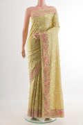 Lemon Yellow Tussar Silk Saree with Embroidery on the body and Embroidery Border.  displayed on a mannequin