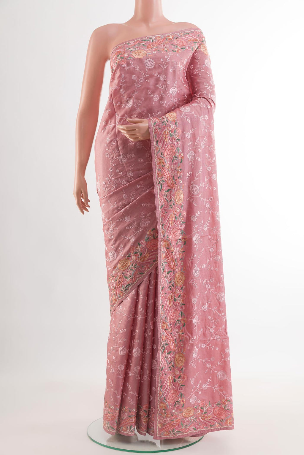 Pink Tussar Silk Saree with Embroidery on the body and Embroidery Border.  displayed on a mannequin