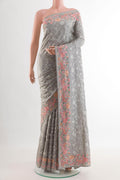 Grey Tussar Silk Saree with Embroidery on the body and Embroidery Border.  displayed on a mannequin