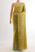 Yellow Tussar Silk Saree with Embroidery on the body and Embroidery Border.  displayed on a mannequin