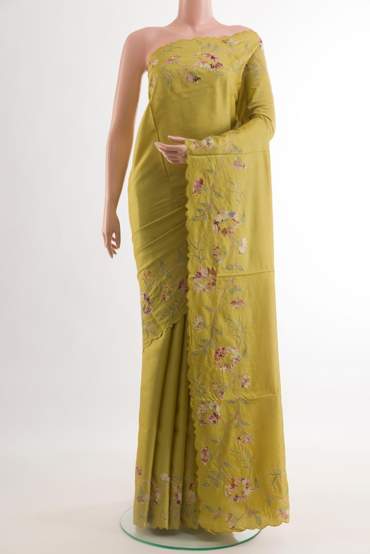 Yellow Tussar Silk Saree with Embroidery on the body and Embroidery Border.  displayed on a mannequin