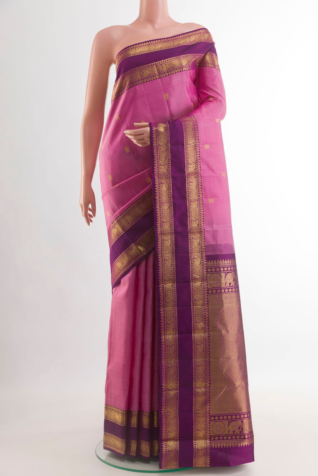 Pink Kanchipuram Silk Saree with Zari Butta on the body and Zari Border.  displayed on a mannequin