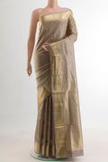Grey Soft Silk Saree with Zari Brocade on the body and Zari Border.  displayed on a mannequin