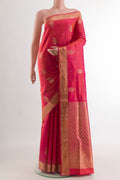 Pink Soft Silk Saree with Zari Butta on the body and Zari Border.  displayed on a mannequin