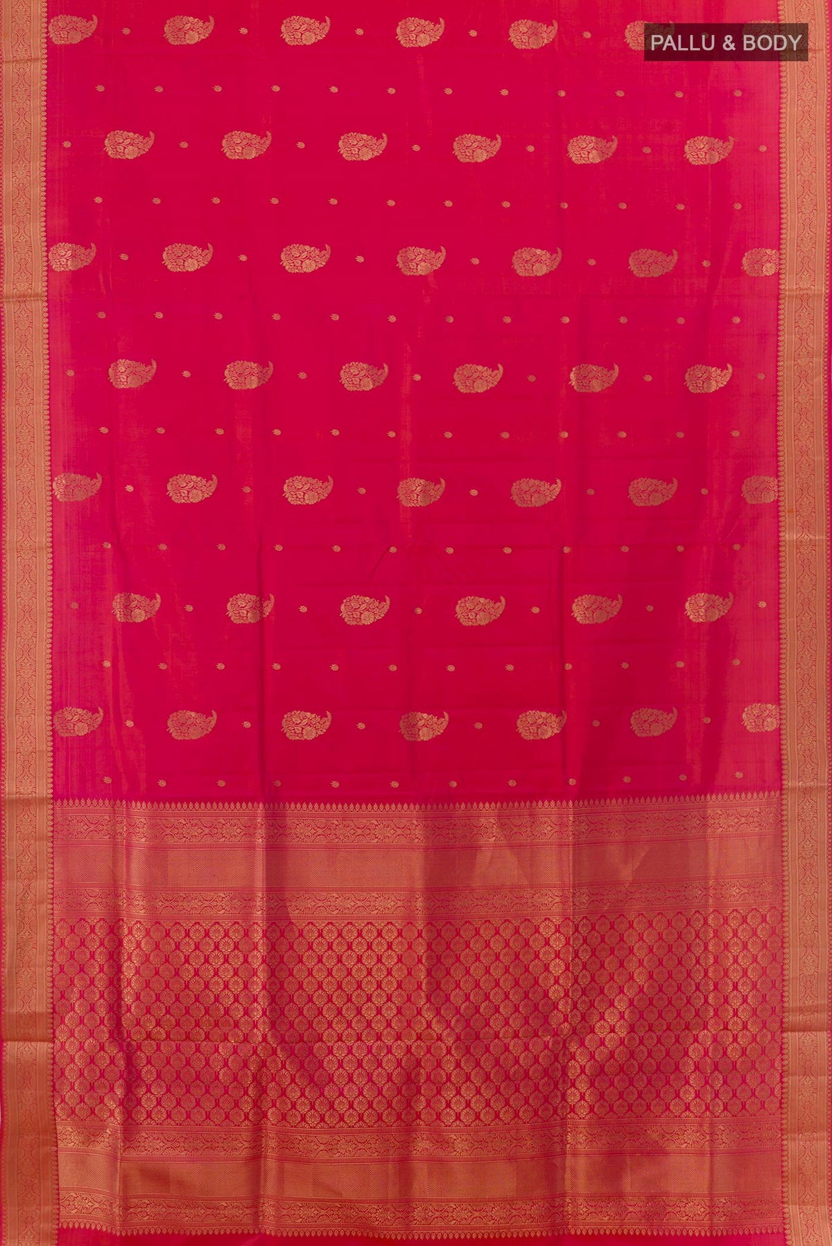 Flat view of Pink Soft Silk Saree with Zari Butta on the body and Zari Border. 