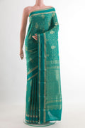 Sea Green Mysore Crepe Saree with Zari Brocade on the body and Zari Border.  displayed on a mannequin