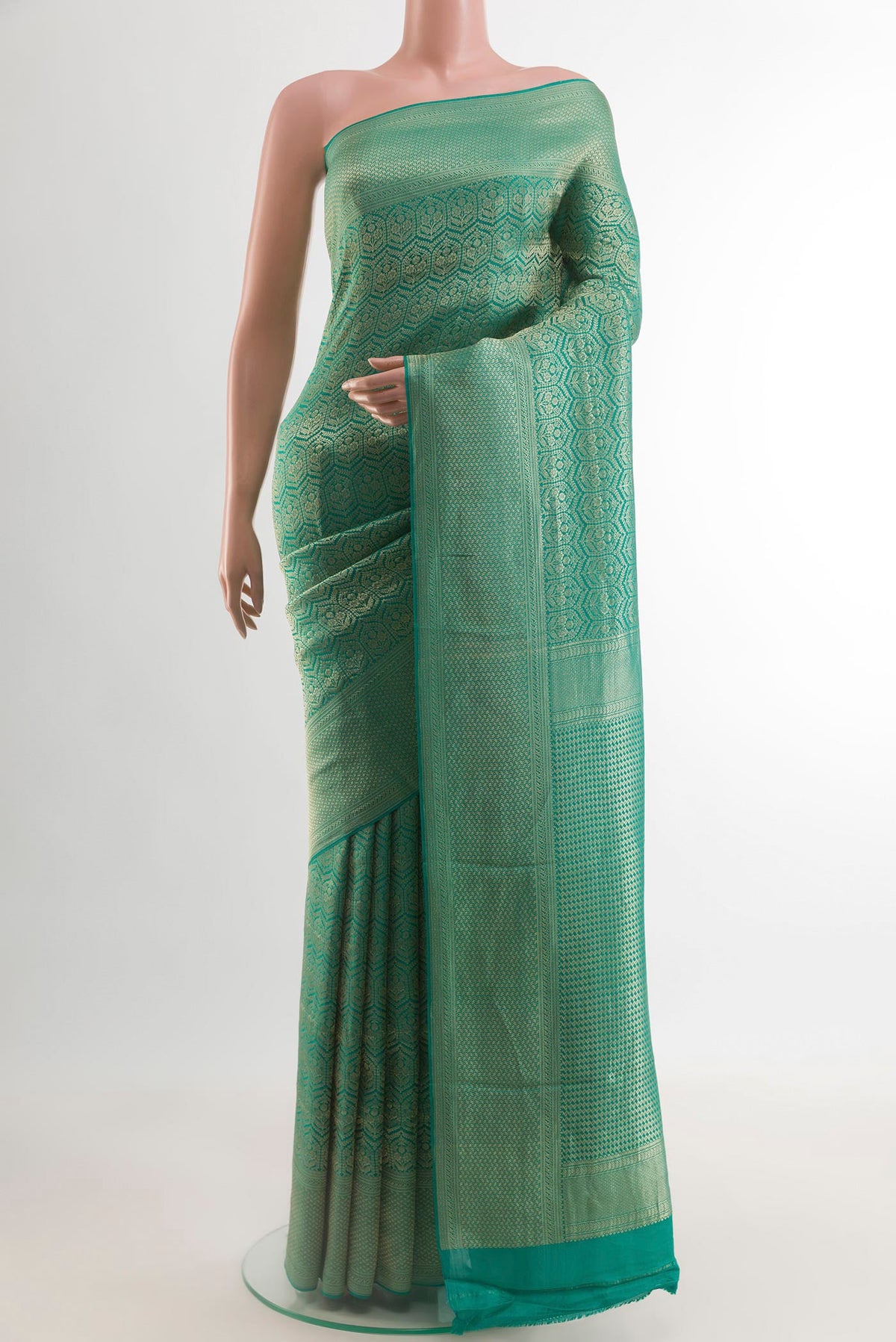 Sea Green Mysore Crepe Saree with Zari Brocade on the body and Zari Border.  displayed on a mannequin
