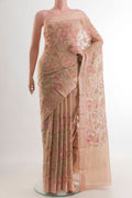 Rose Gold Mysore Georgette Saree with Embroidery on the body and Zari Border.  displayed on a mannequin