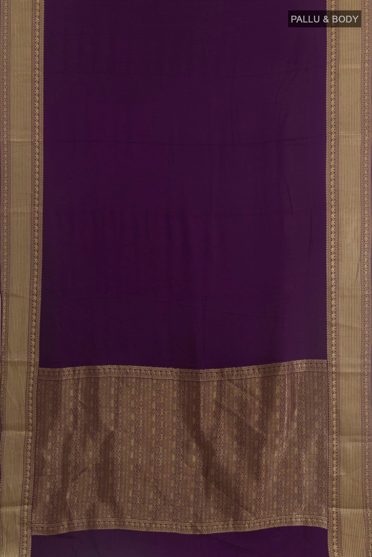 Flat view of Purple Mysore Crepe Saree with Plain Body and Zari Border. 