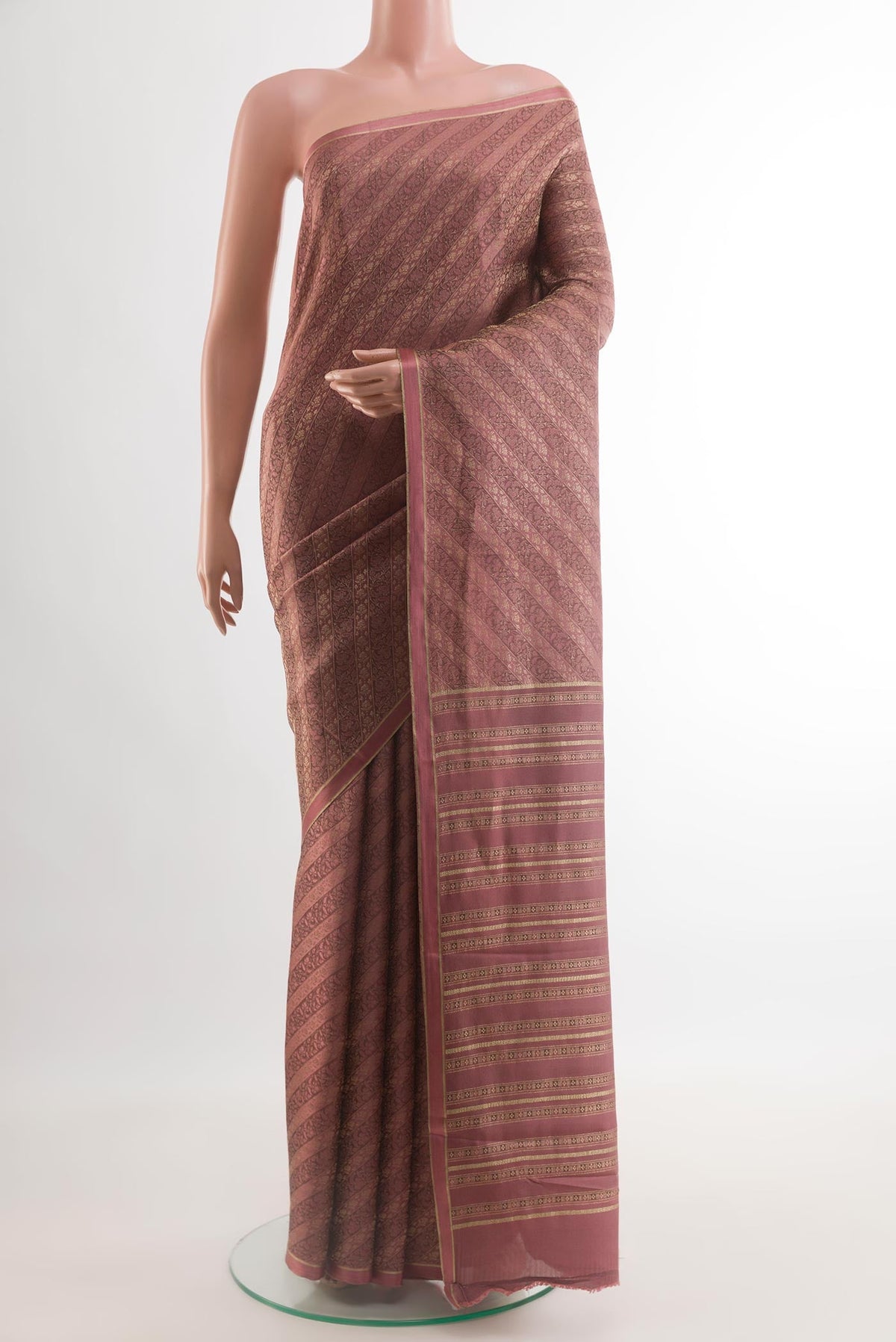 Mauve Mysore Crepe Saree with Zari Brocade on the body and Zari Border.  displayed on a mannequin