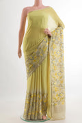 Lemon Yellow Mysore Crepe Saree with Plain Body and Zari Border.  displayed on a mannequin
