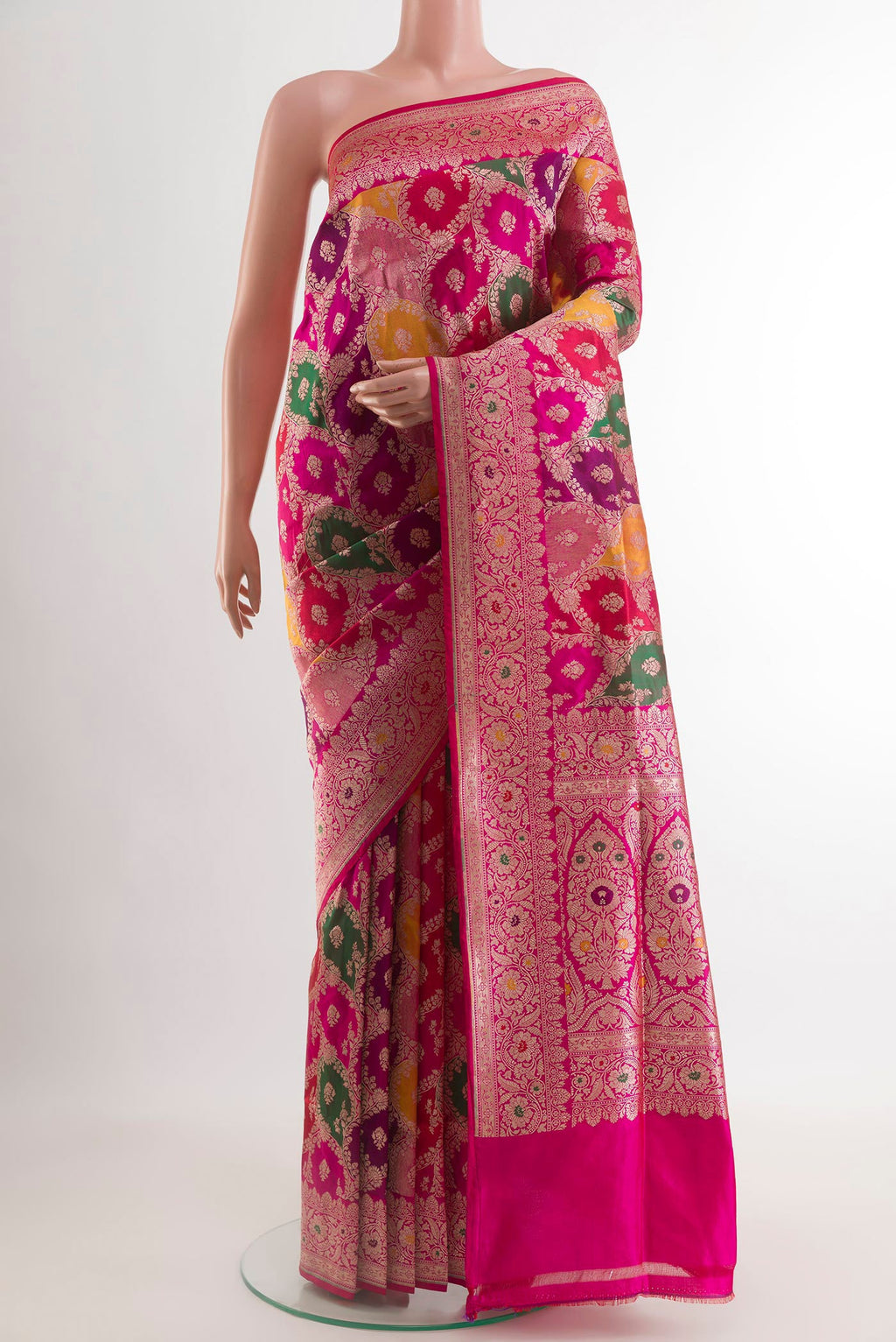 Multi Color Banarasi Silk Saree with Zari Brocade on the body and Zari Border.  displayed on a mannequin