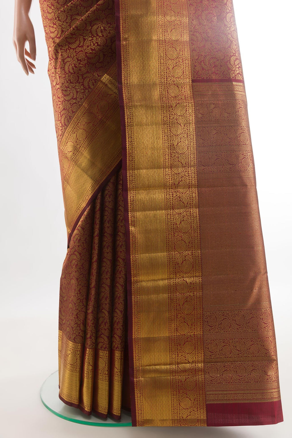 Pleats and pallu of Maroon Kanchipuram Silk Saree with Zari Brocade on the body and Zari Border. 