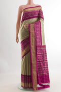 Beige Pochampally Silk Saree with Plain Body and Ikat Border.  displayed on a mannequin