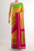Yellow Pochampally Silk Saree with Pure Ikat on the body and Ganga Jamuna Border.  displayed on a mannequin