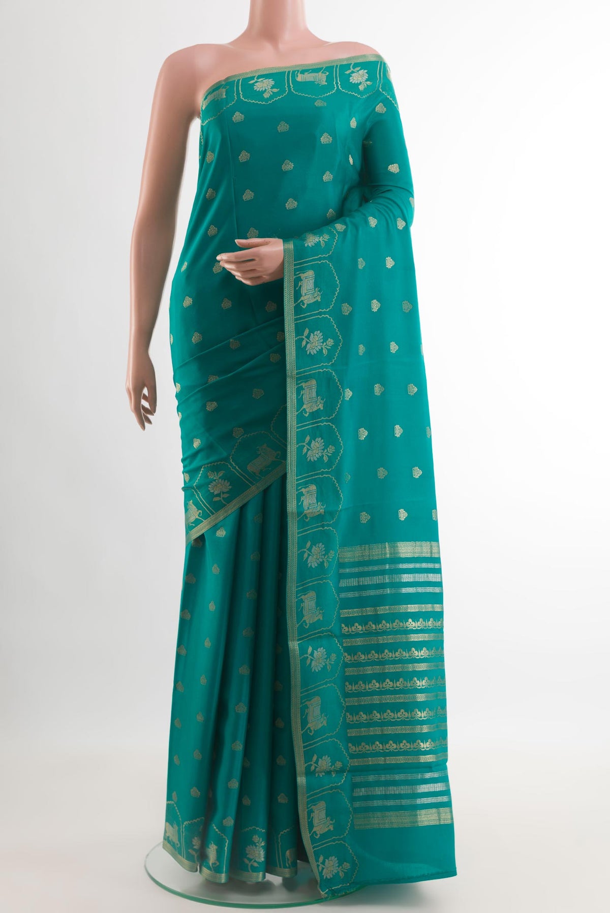 Sea Green Mysore Crepe Saree with Zari Butta on the body and Zari Border.  displayed on a mannequin