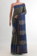 Grey Tussar Silk Saree with Printed design on the body and Zari Border.  displayed on a mannequin