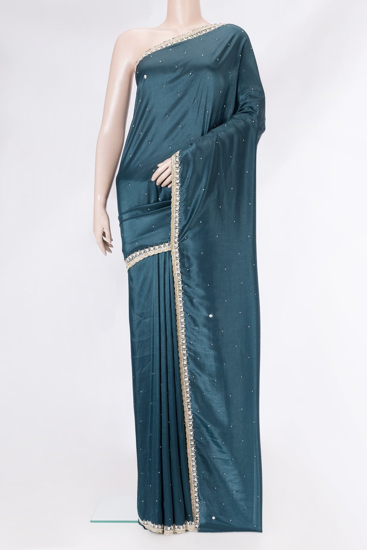 Peacock Blue Dual Tone Mysore Crepe Saree with Embroidery on the body and Embroidery Border.  displayed on a mannequin