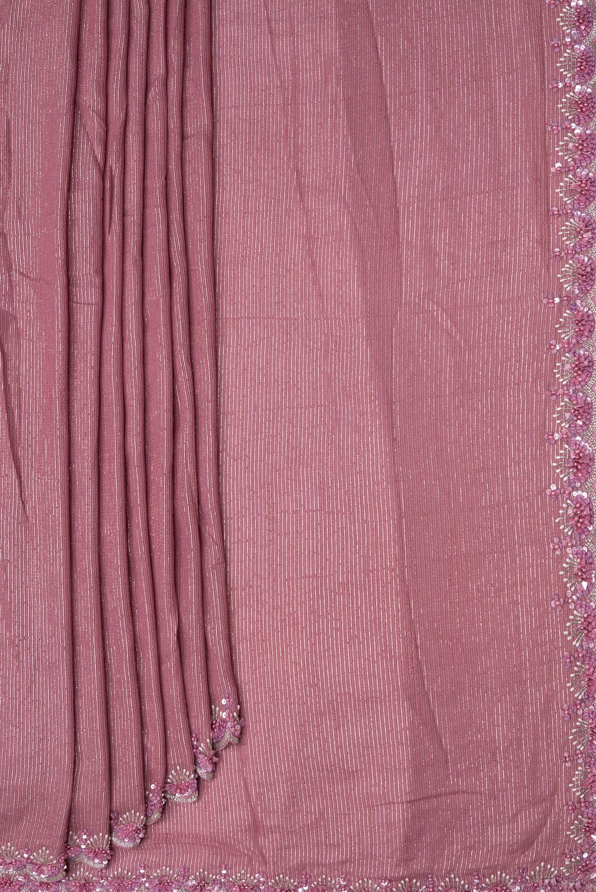 Pleats and pallu of Pink Dual Tone Georgette Saree with Zari Brocade on the body and Embroidery Border. 