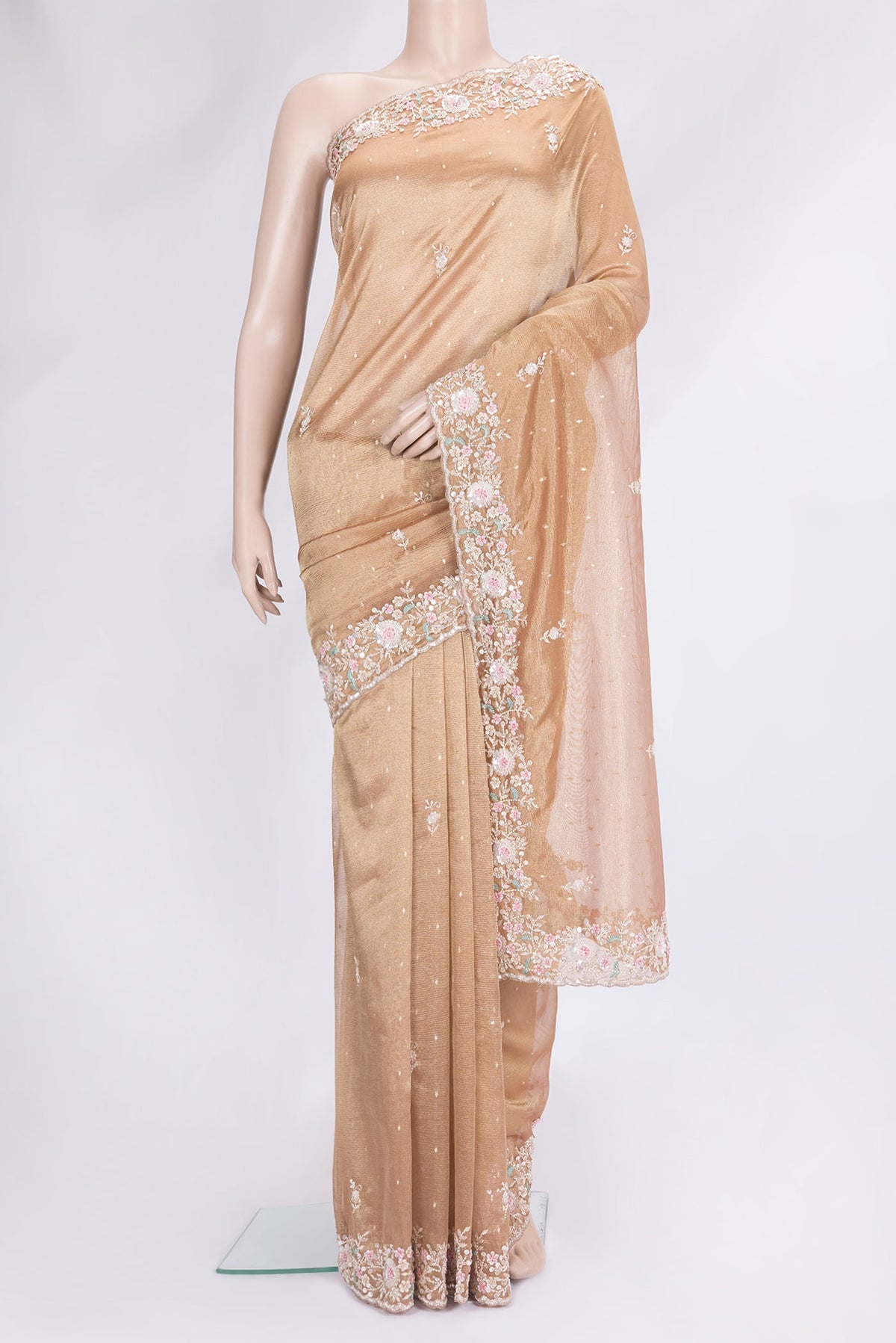 Rose Gold Dual Tone Organza Silk Saree with Embroidery on the body and Embroidery Border.  displayed on a mannequin