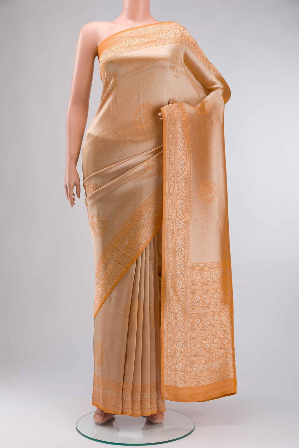 Orange Blended Art Silk Saree with Zari Butta on the body and Zari Border displayed on a mannequin
