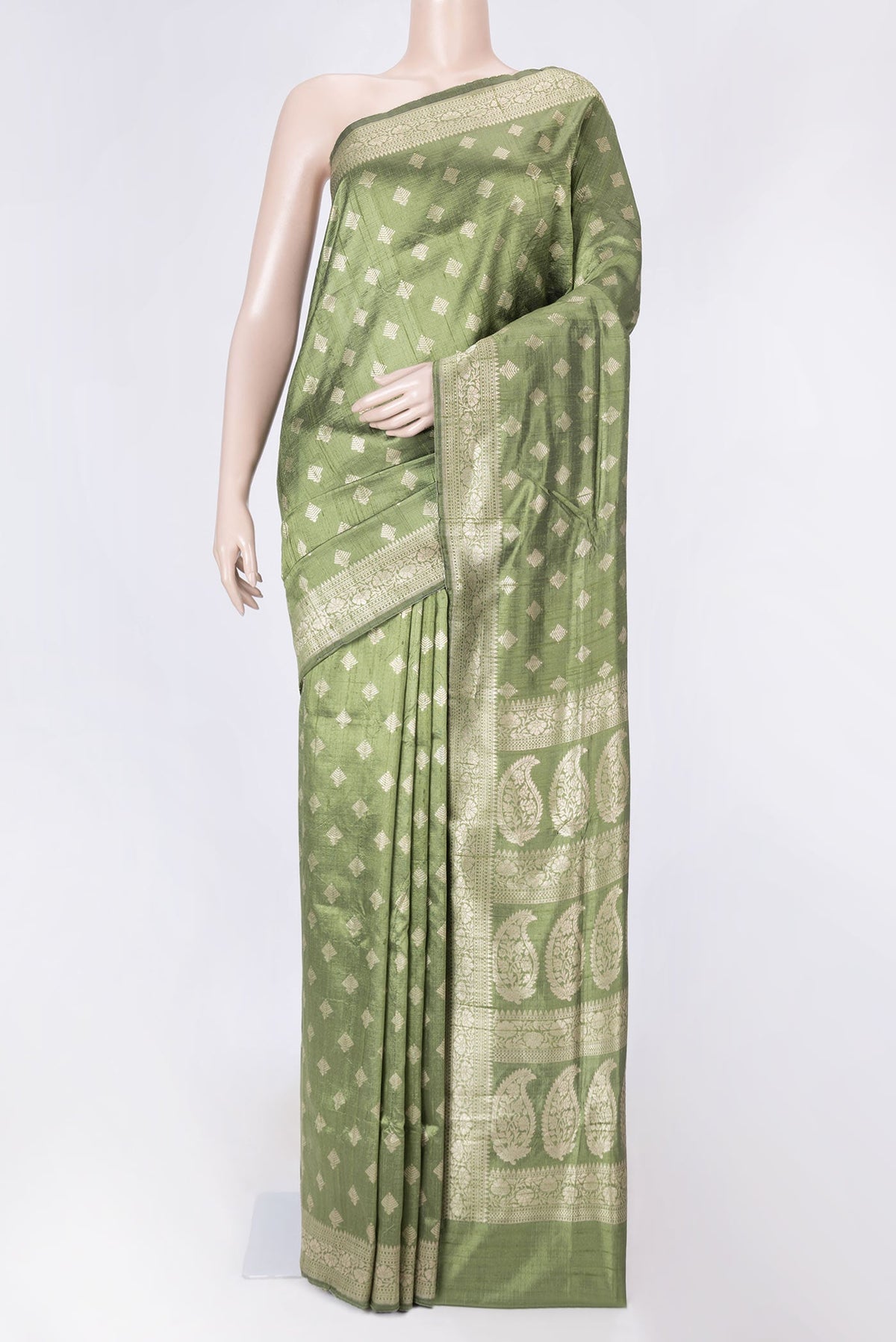 Green Dual Tone Raw Silk Saree with Zari Brocade on the body and Zari Border displayed on a mannequin