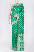 Green Dual Tone Raw Silk Saree with Zari Brocade on the body and Zari Border displayed on a mannequin