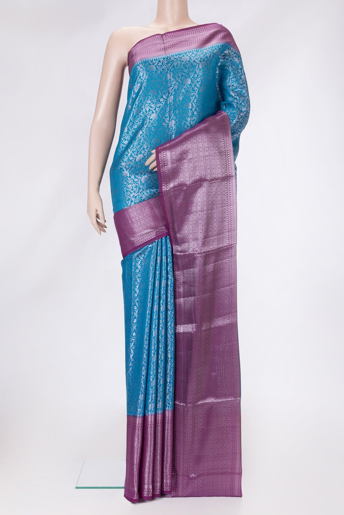 Sky Blue Dual Tone Tussar Silk Saree with Zari Brocade on the body and Zari Border.  displayed on a mannequin