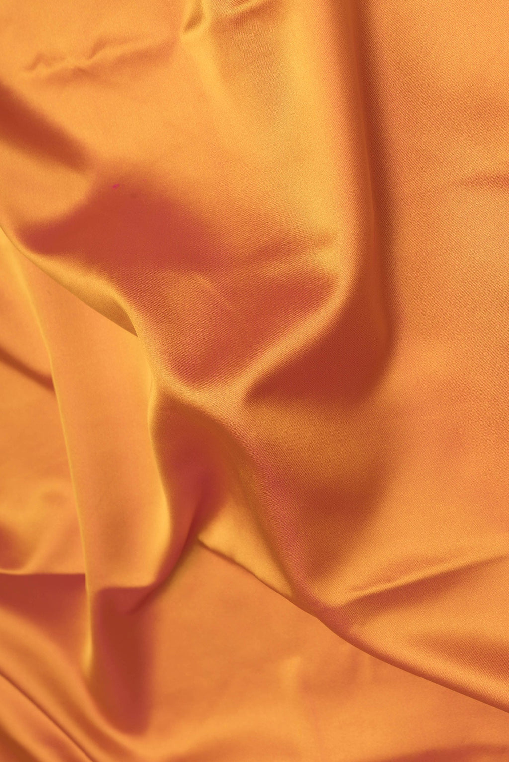 Close up of Yellow Dual Tone Banarasi Silk Saree with Plain Body and Fancy Border.  displaying folds