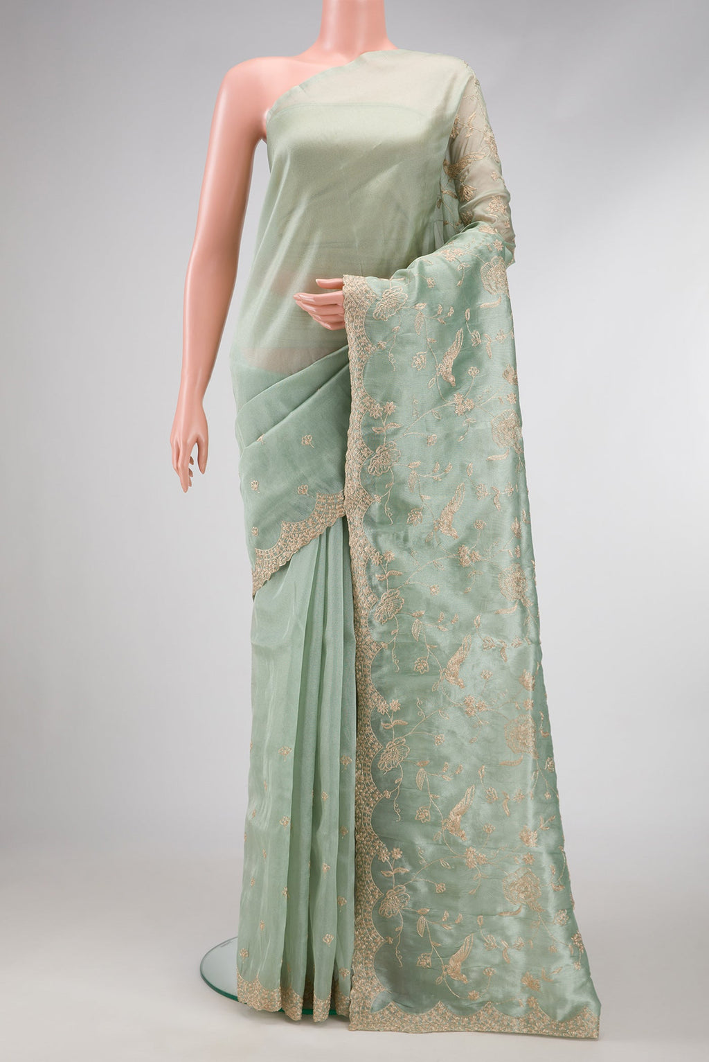 Sea Green Dual Tone Blended Organza Silk Saree with Embroidery on the body and Embroidery Border.  displayed on a mannequin