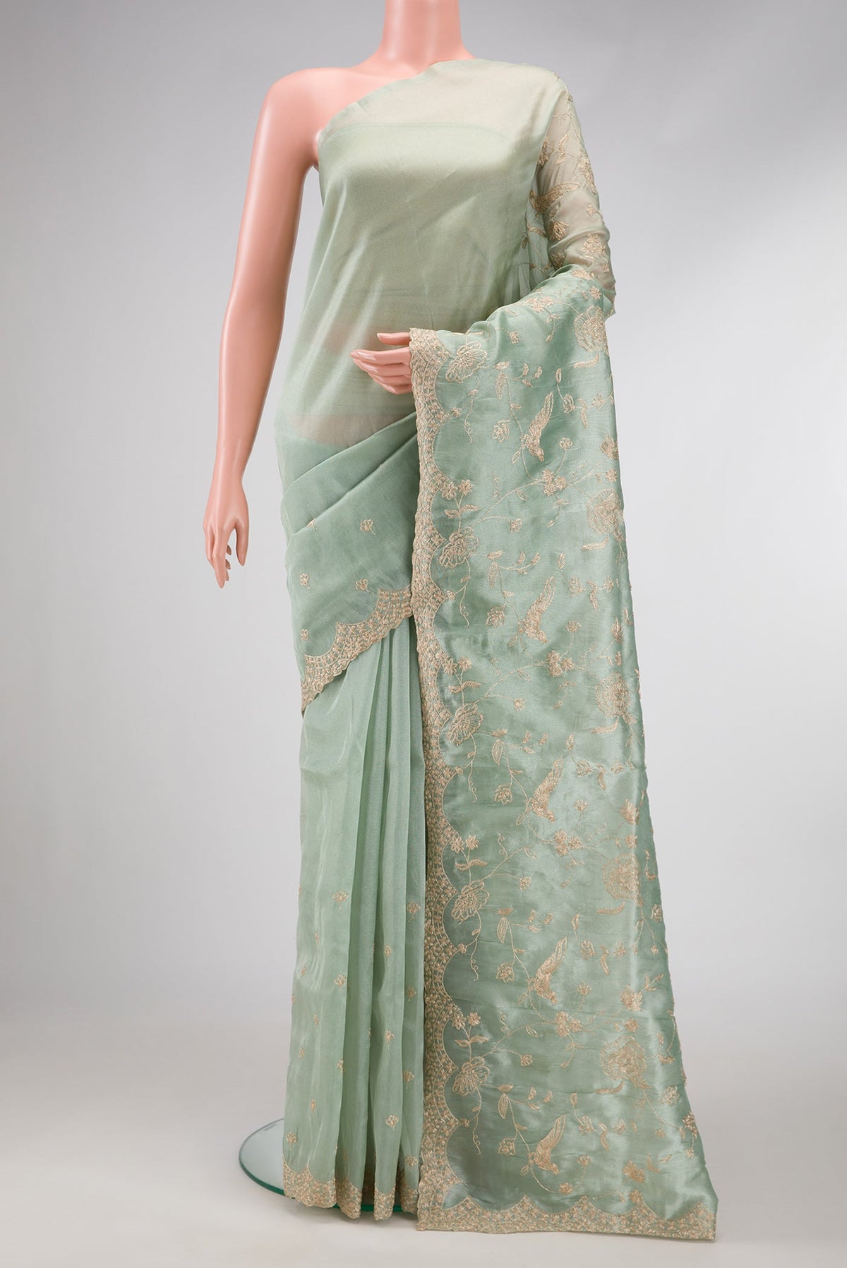 Sea Green Dual Tone Blended Organza Silk Saree with Embroidery on the body and Embroidery Border.  displayed on a mannequin
