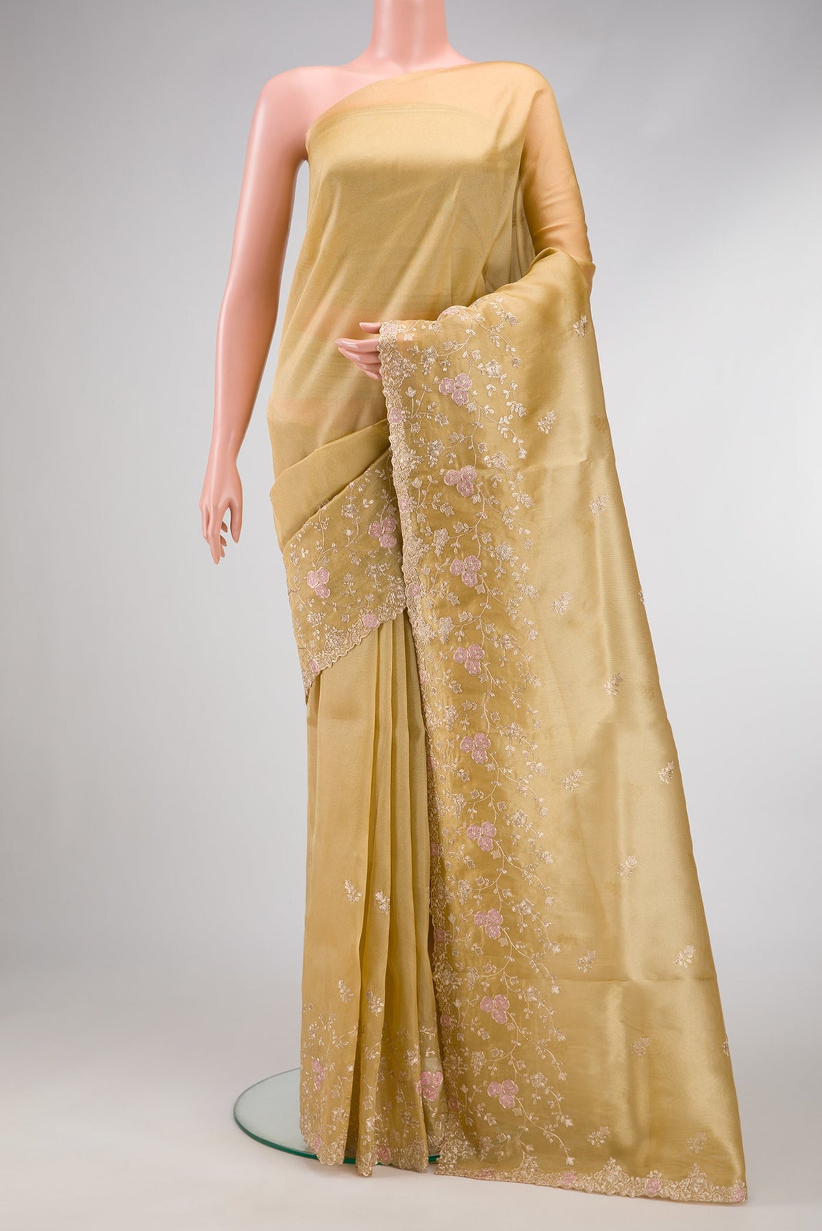 Gold Dual Tone Blended Organza Silk Saree with Embroidery on the body and Embroidery Border.  displayed on a mannequin
