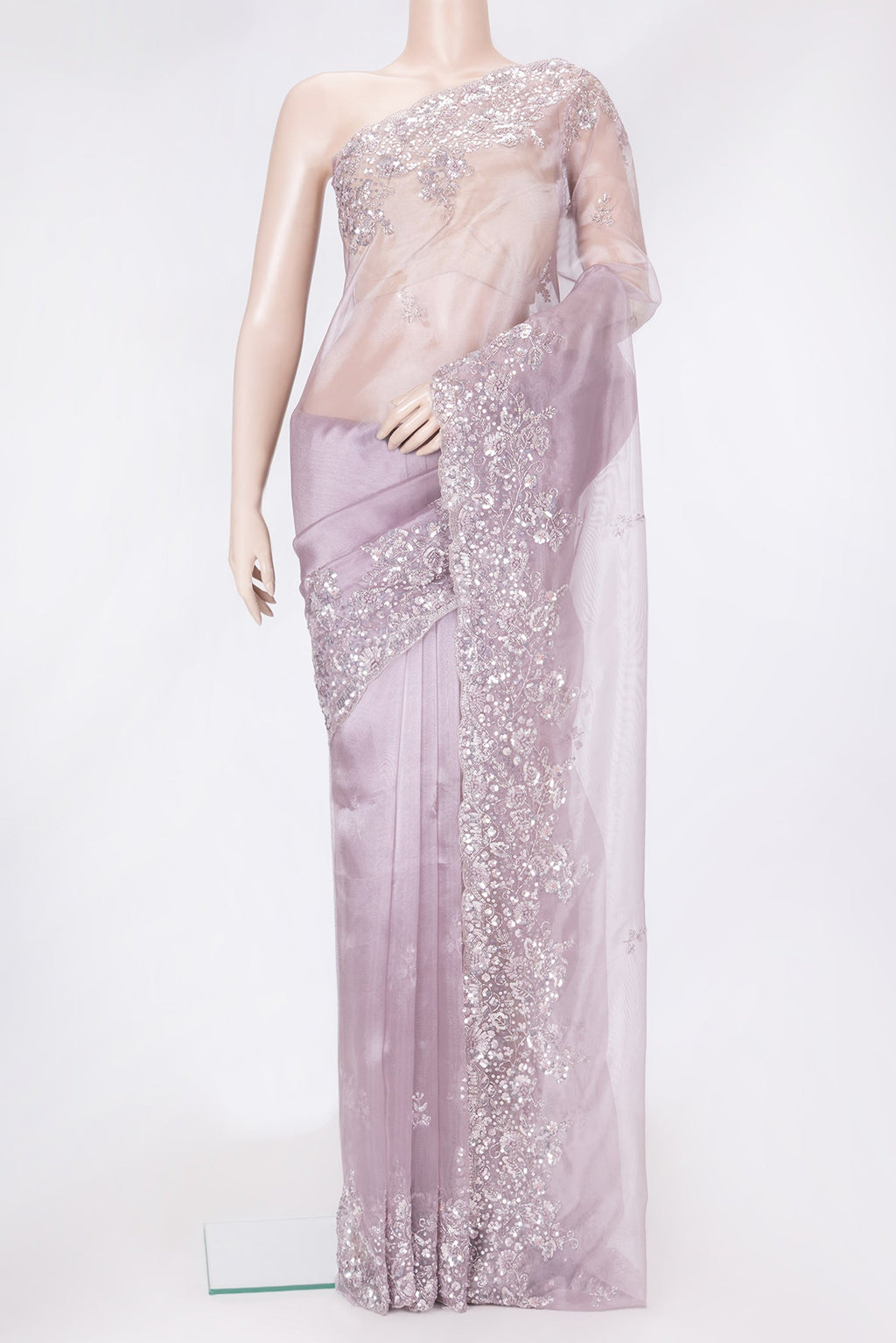 Lilac Dual Tone Organza Silk Saree with Embroidery on the body and Embroidery Border.  displayed on a mannequin