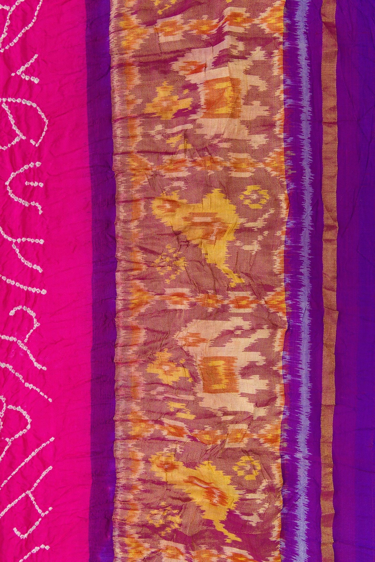 Border image of Pink Dual Tone Bandhani Silk Saree with Bandhani Print on the body and Ikat Border. 