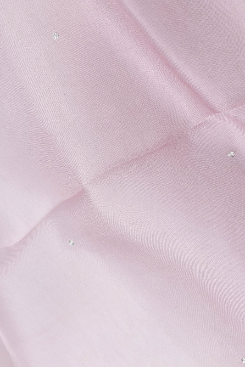 Close up of Rose pink Dual Tone Organza Silk Saree with Embroidery on the body and Embroidery Border.  displaying folds