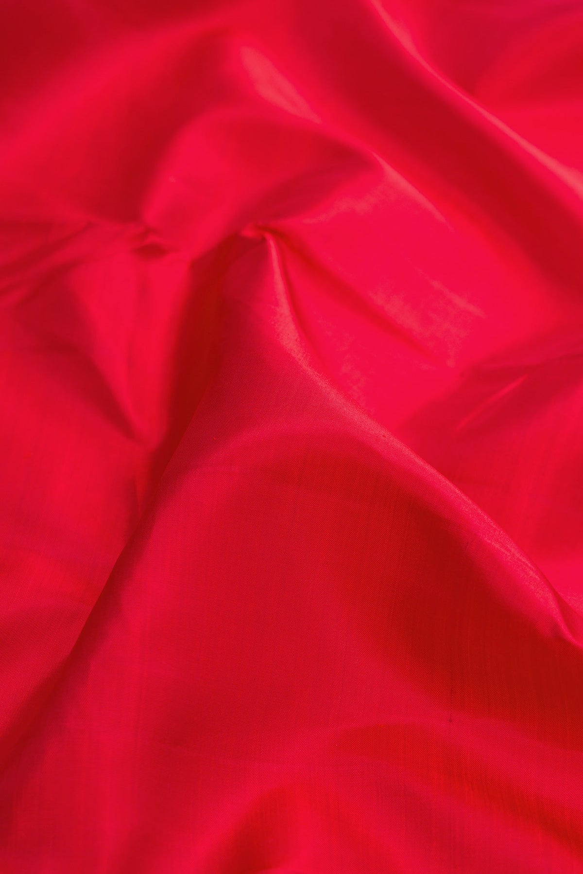 Close up of Pure Silk Pure Zari Red Dual Tone Kanjivaram Nine Yards Saree with Plain Body and Zari Border.  displaying folds
