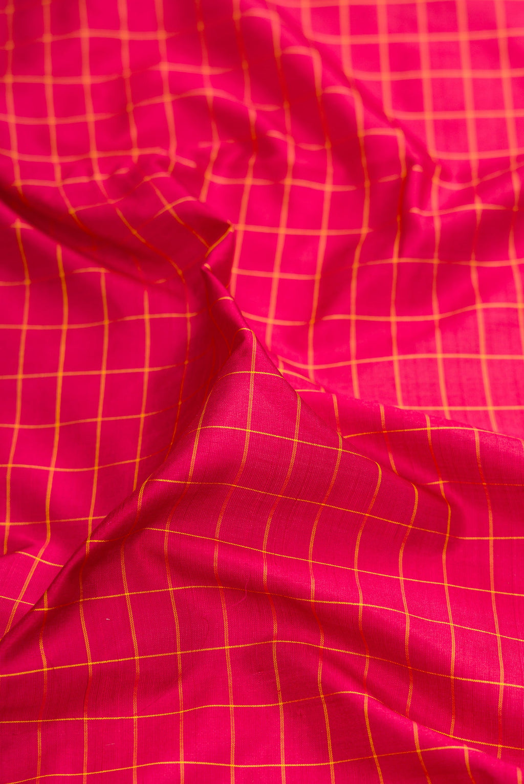 Close up of Maroon Kanchipuram Silk Nine Yards Saree with Checked design on the body and Zari Border.  displaying folds