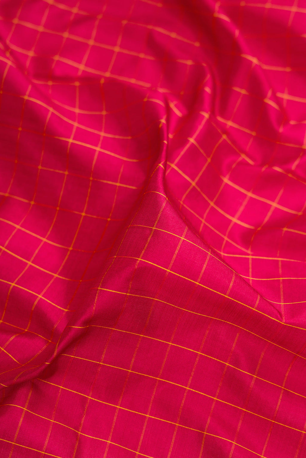 Close up of Maroon Kanchipuram Silk Nine Yards Saree with Checked design on the body and Zari Border.  displaying folds