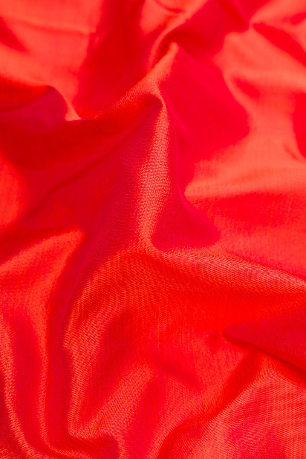 Close up of Orange Dual Tone Kanchipuram Silk Nine Yards Saree with Plain Body and Zari Border.  displaying folds