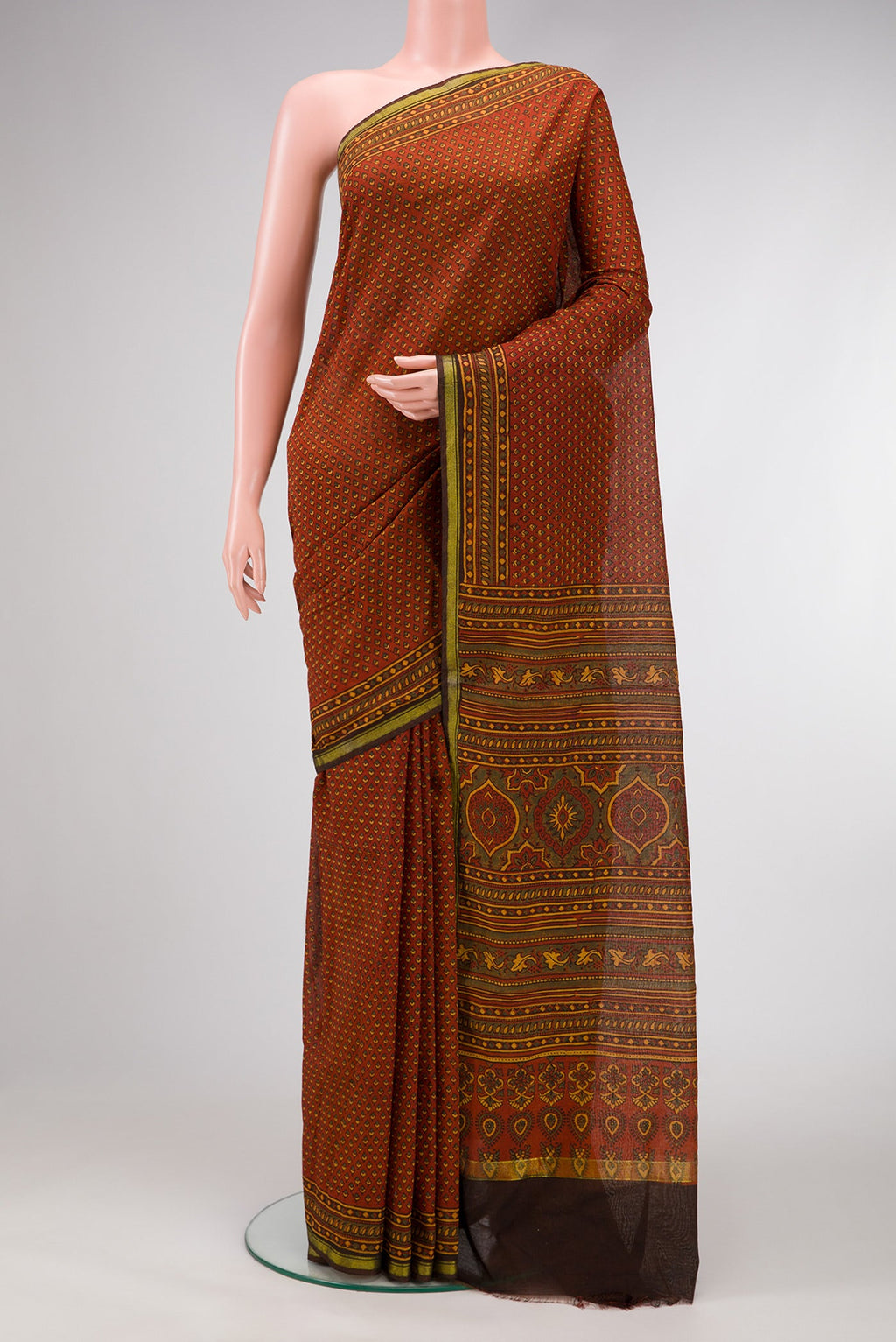 Orange Dual Tone Cotton Saree with Ajrakh Print on the body and Zari Border.  displayed on a mannequin