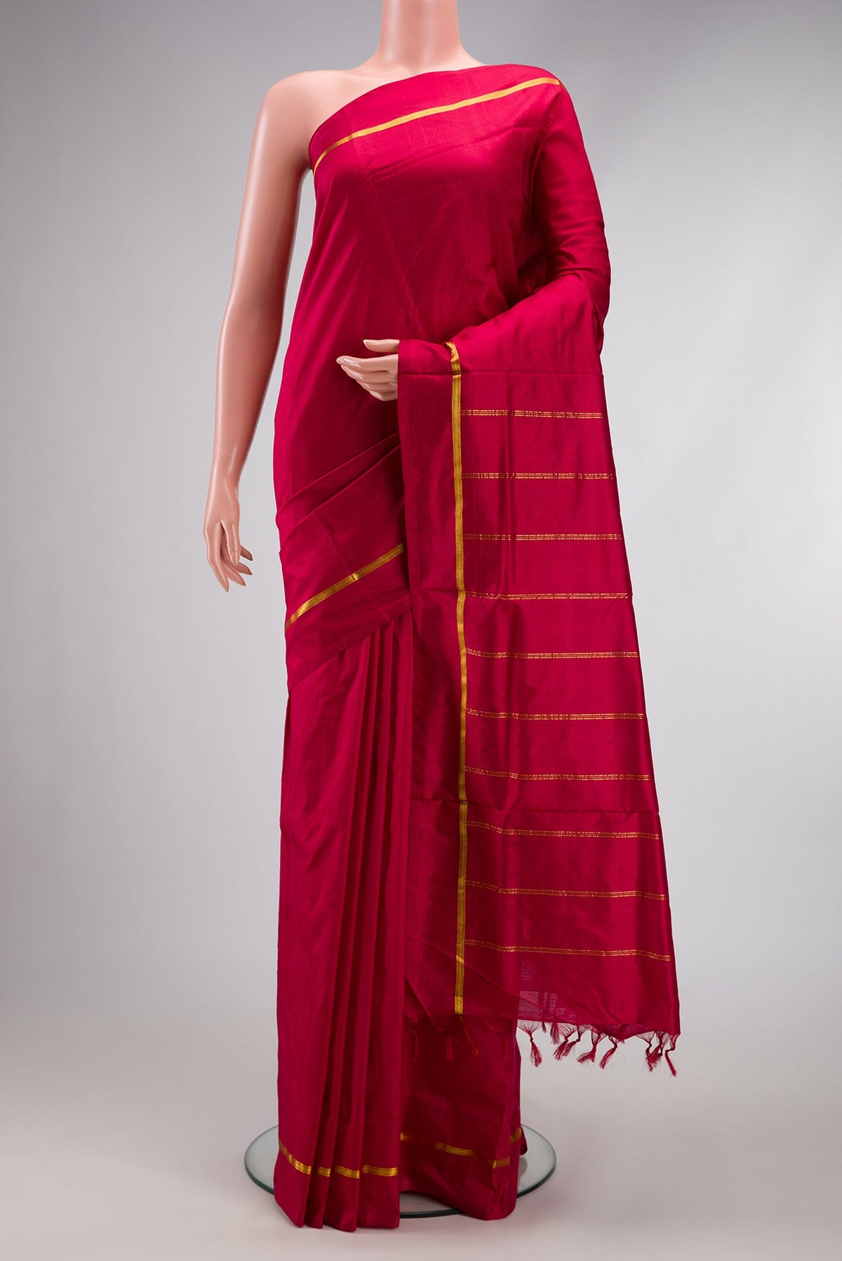 Maroon Kanchipuram Silk Nine Yards Saree with Plain Body and Zari Border.  displayed on a mannequin