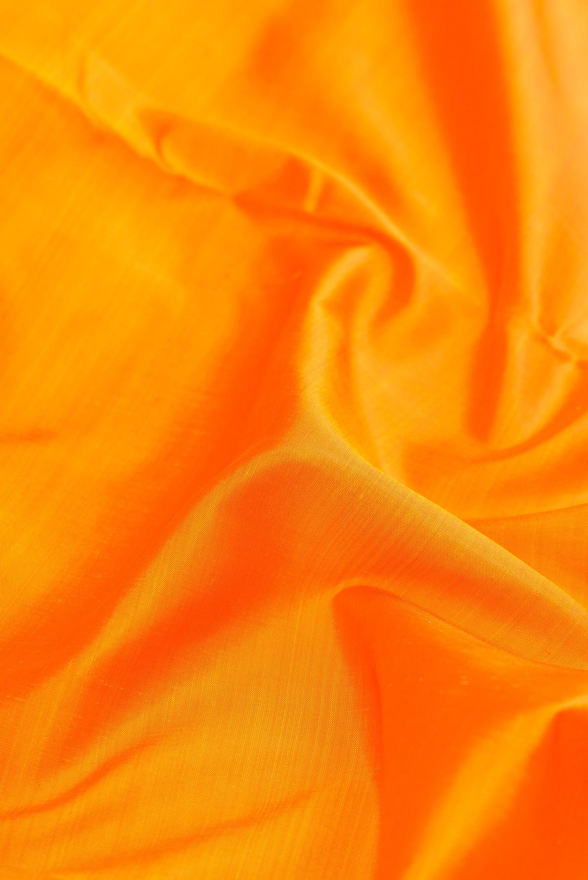 Close up of Pure Silk Pure Zari Yellow Dual Tone Kanchipuram Nine Yards Saree with Plain Body and Zari Border.  displaying folds