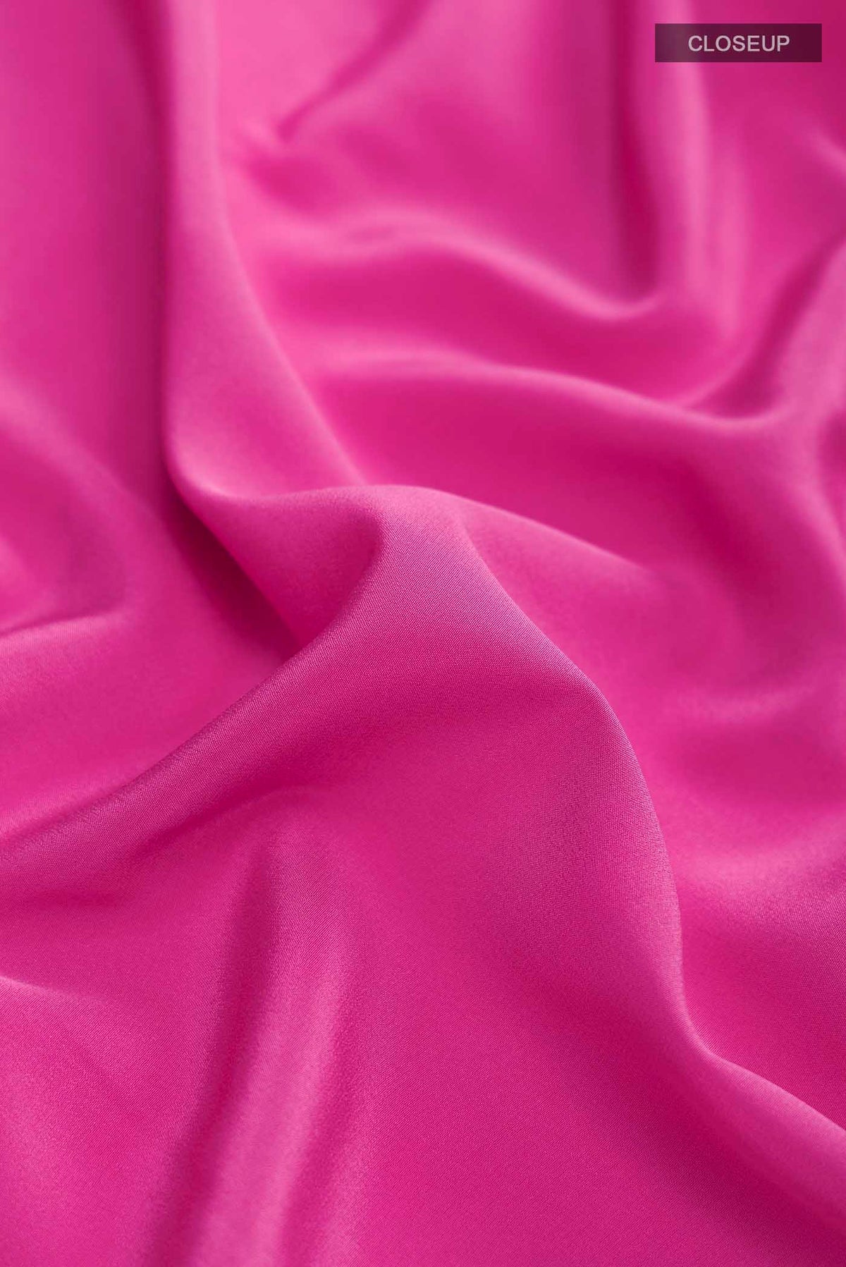 Close up of Pure Silk Pure Zari Pink Mysore Crepe Saree with Plain Body and Zari Border displaying folds