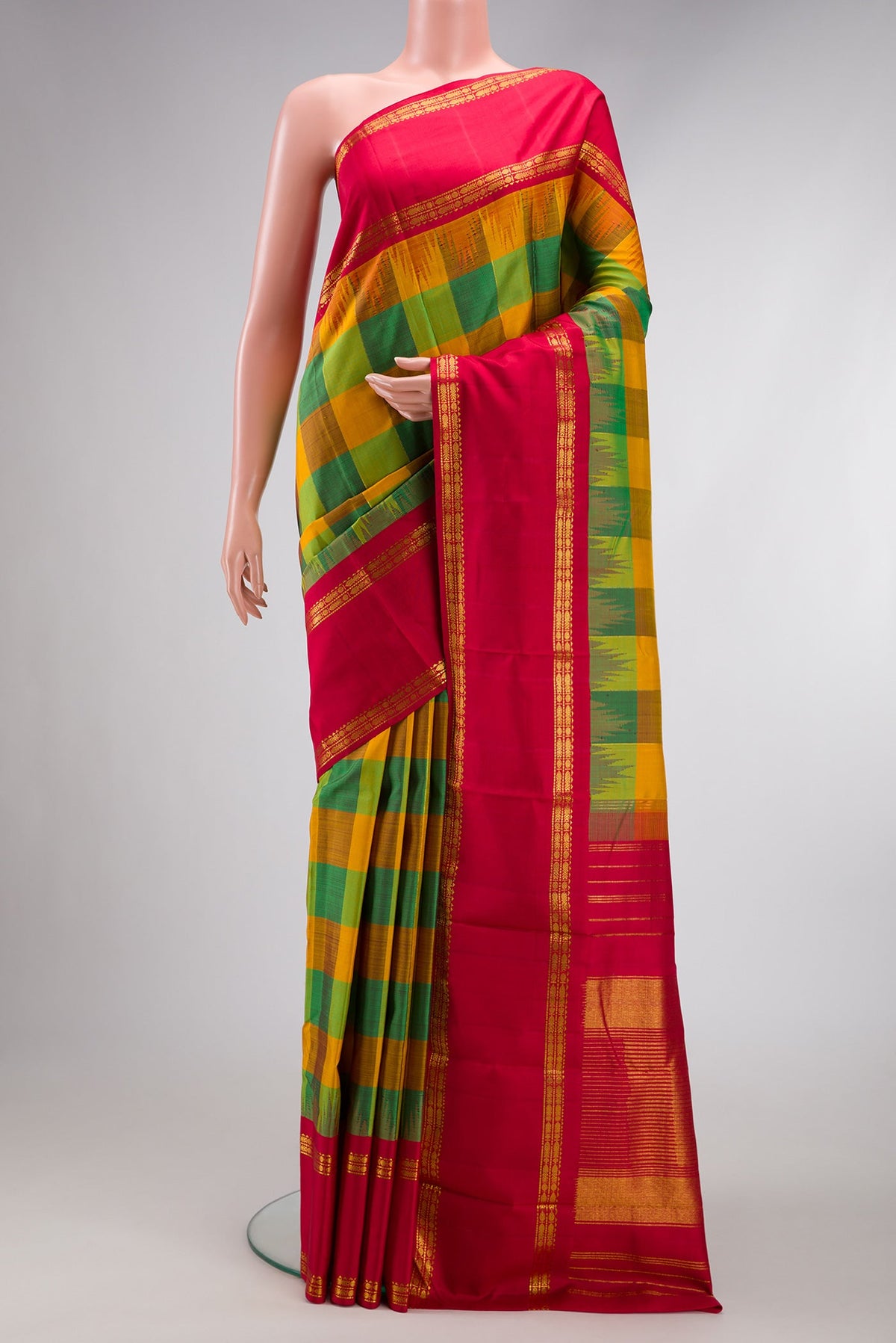 Mustard, Parrot Green and Bottle Green Color Kanjivaram Silk Saree with Checked design on the body and Temple Border.  displayed on a mannequin